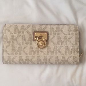 Brown and white michael kors wallet